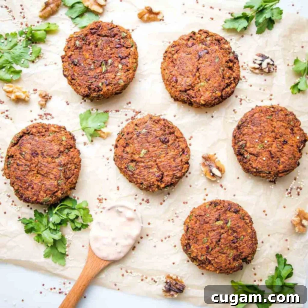 Veggie burger patties spread out, surrounded by walnuts and fresh herbs, ready for cooking.
