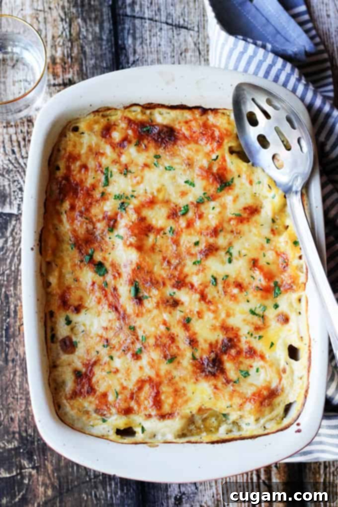 Acorn Butternut Squash Casserole with a serving spoon