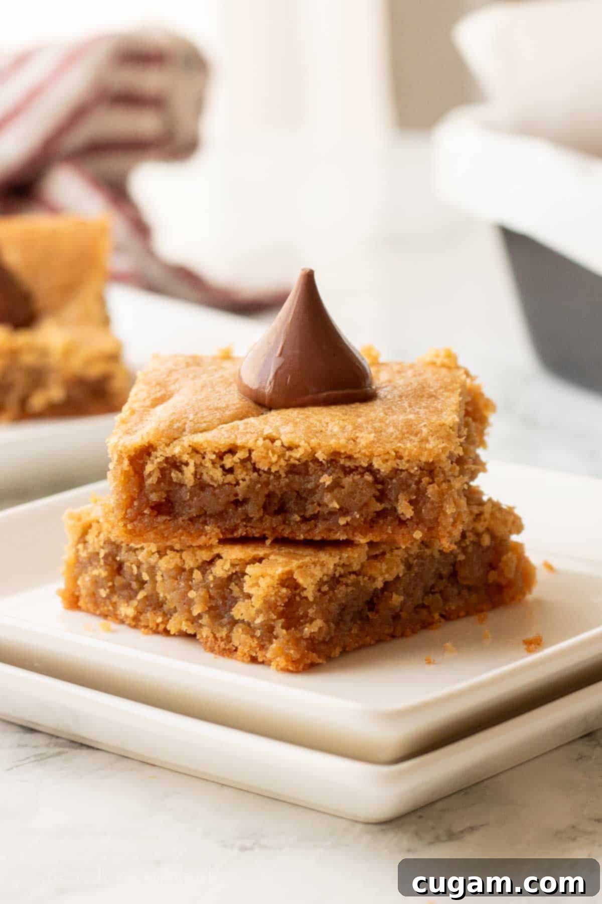 Peanut Butter blossom bar slices on plate.
