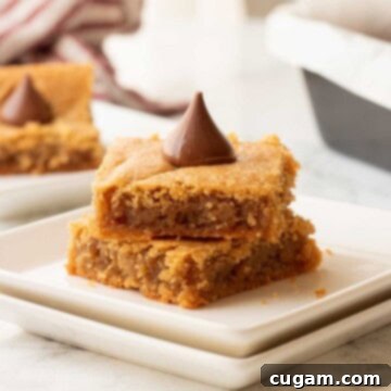 Peanut Butter blossom bar slices on plate.
