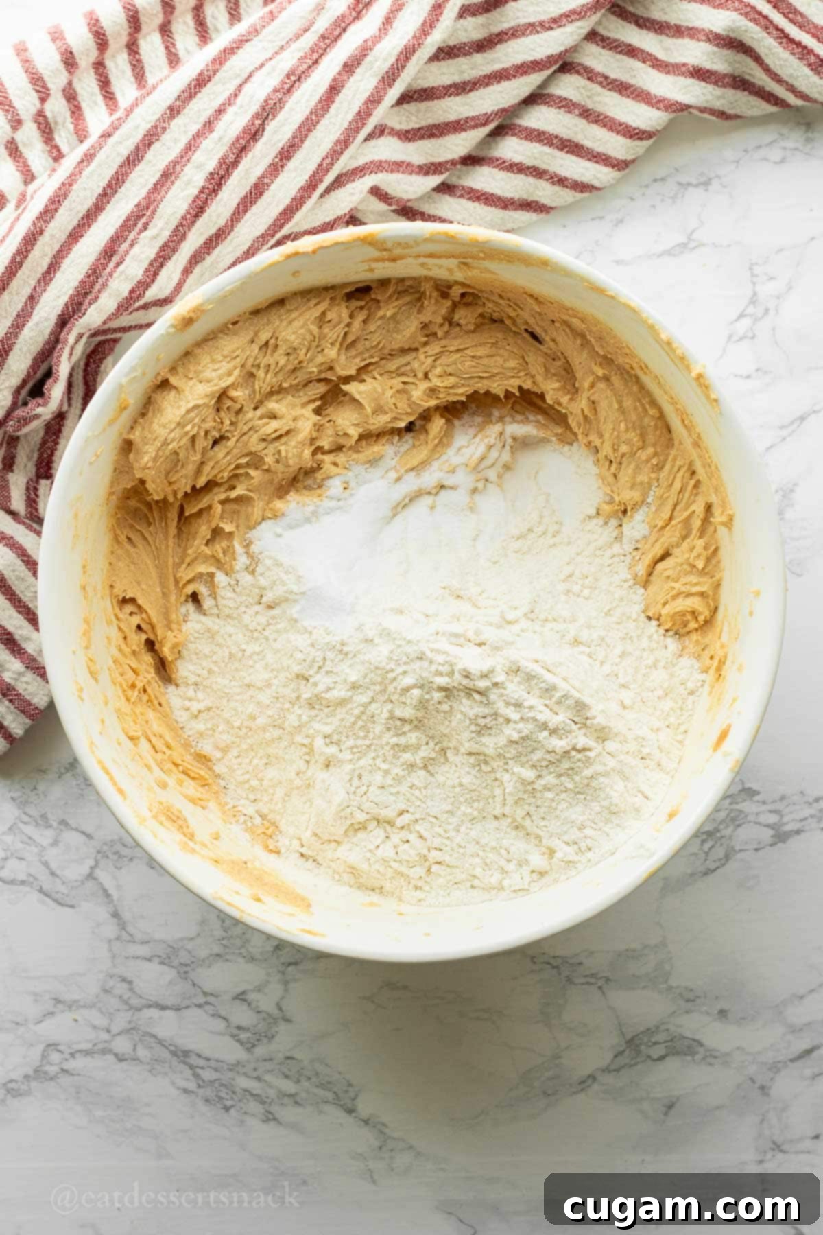 Flour and baking soda in peanut butter bar batter.