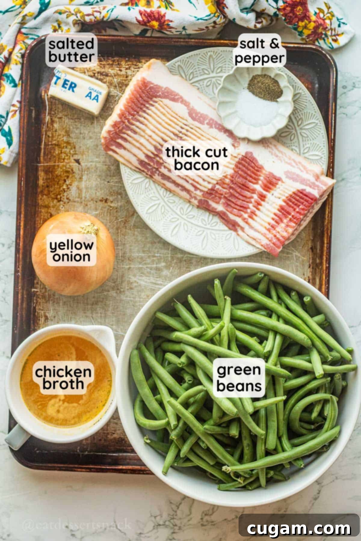 Labeled ingredients for green beans with bacon and onion on metal pan in glass dishes.