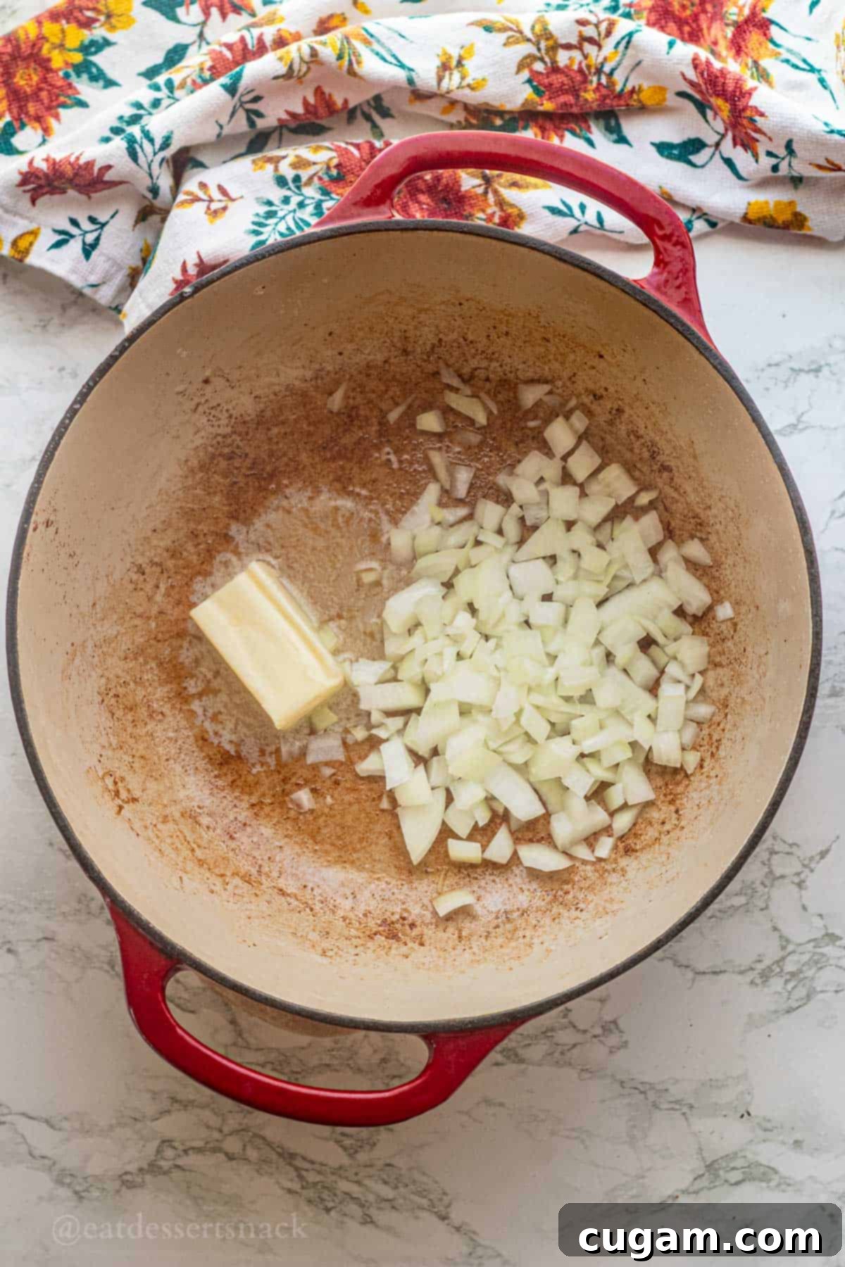 Butter and raw onions in pan.