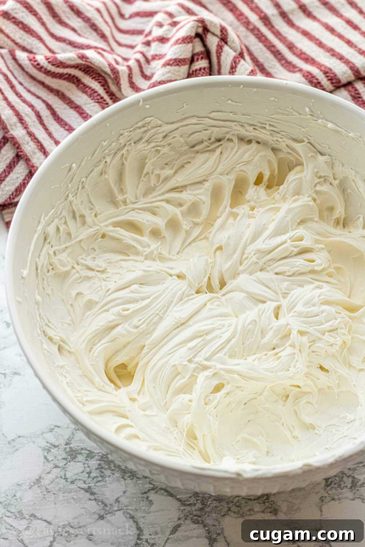 Cloud-Light Cream Cheese Whip 7 Finished cream cheese whipped cream in a bowl, showing its light and fluffy texture.