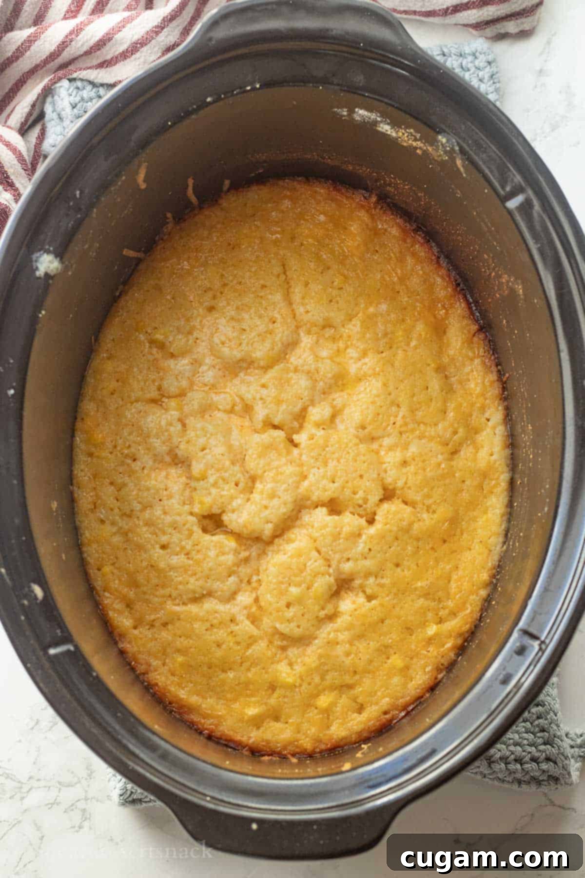 Cooked cornbread pudding in slow cooker.