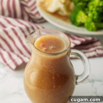 Glass pitcher of gravy.
