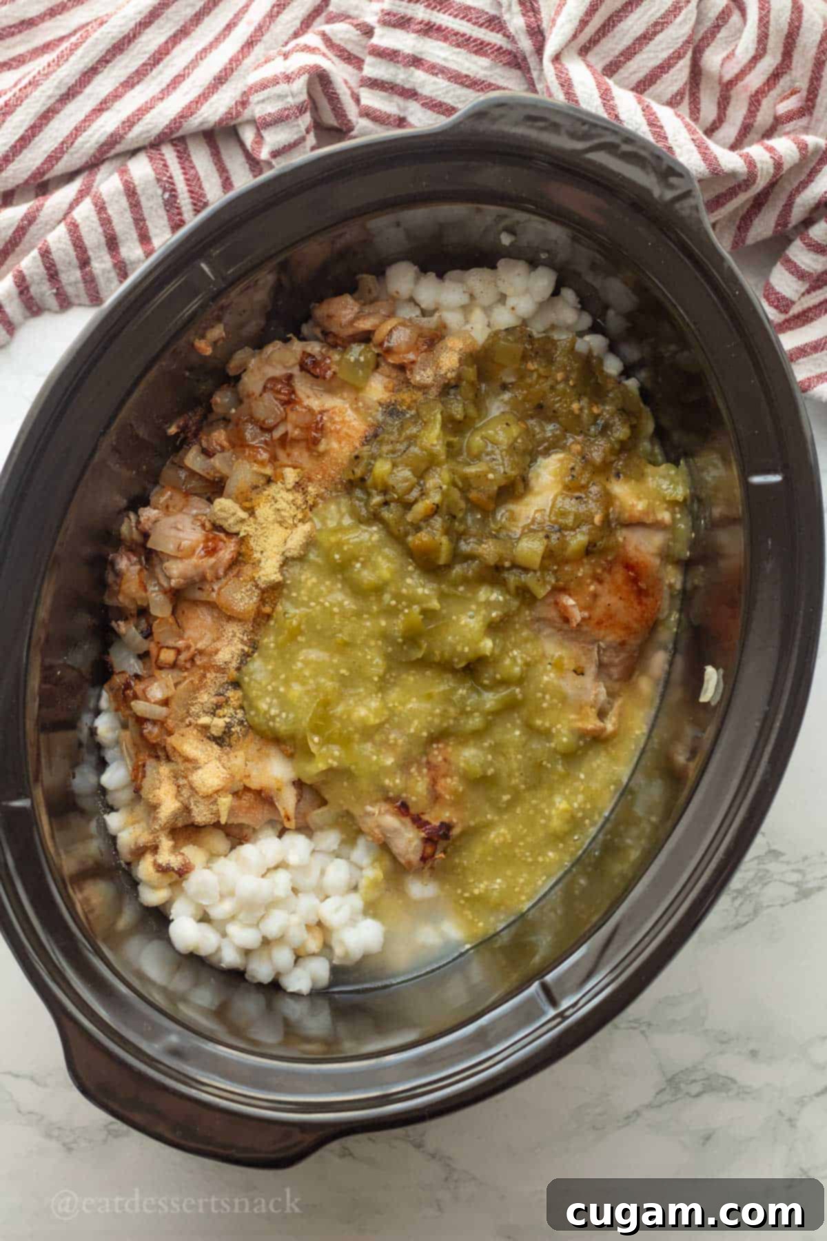 Green Chile Chicken Stew 6 Tomatillos and green chiles in crockpot with chicken before cook.