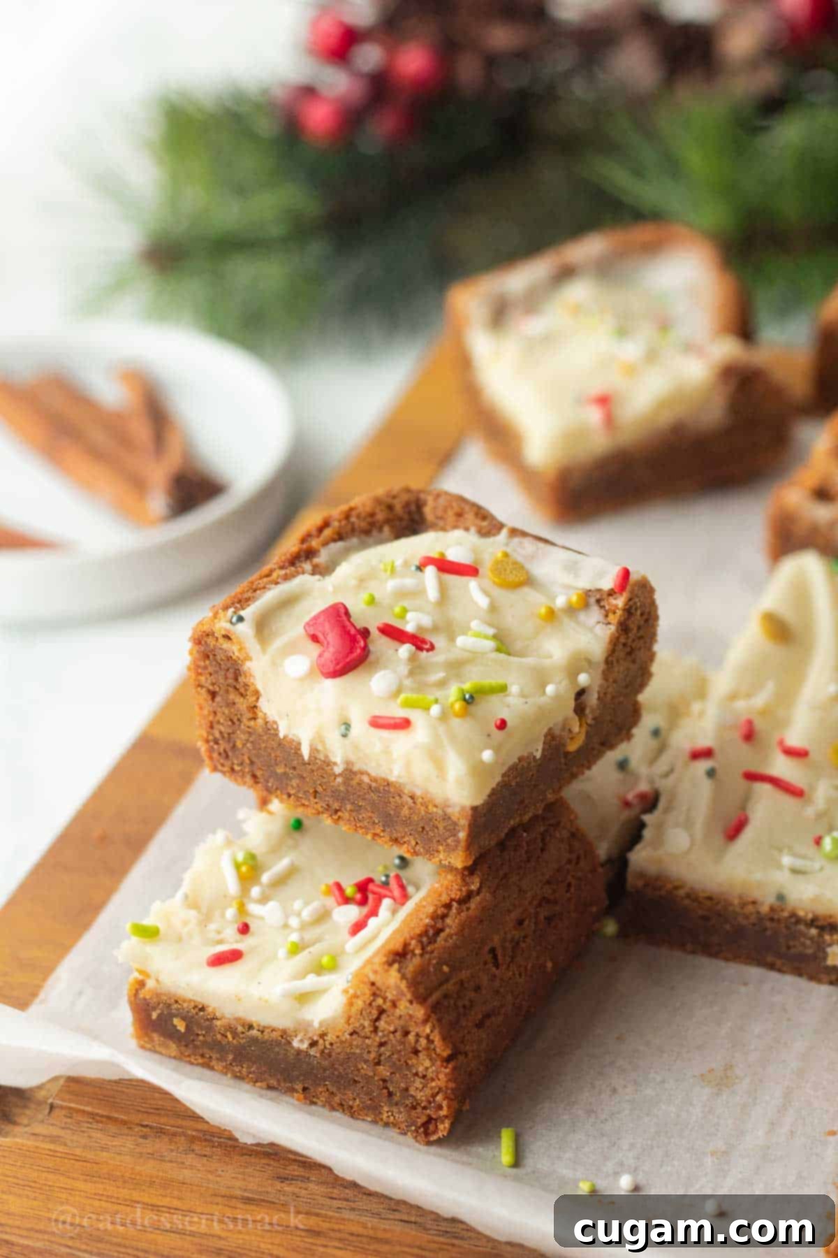 Frosted Gingerbread Squares 2 Slice of gingerbread bar stacked, showcasing its soft texture and inviting frosting.