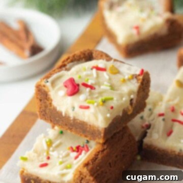 Frosted Gingerbread Squares 12 Slices of gingerbread bar stacked.