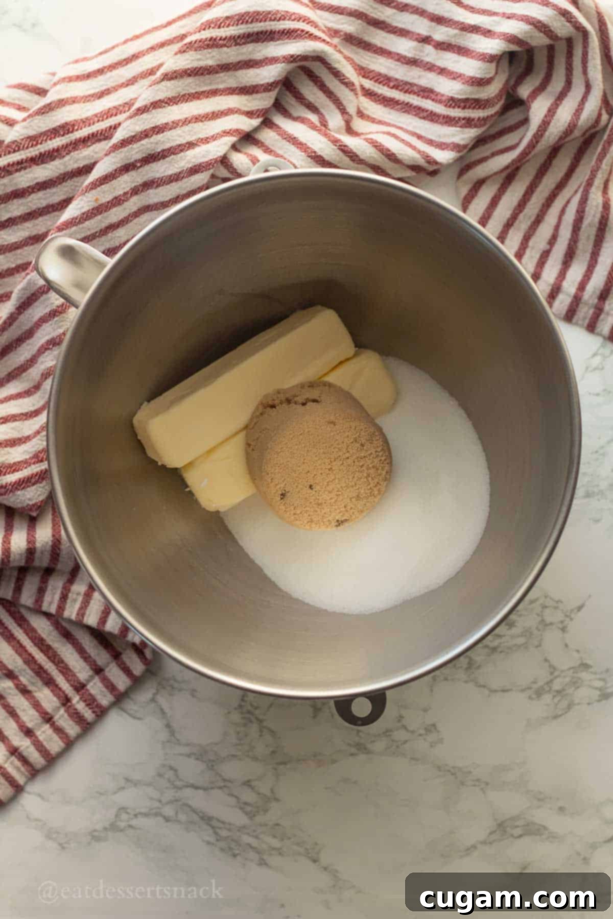 Frosted Gingerbread Squares 4 Butter and sugars being creamed together in a mixing bowl.