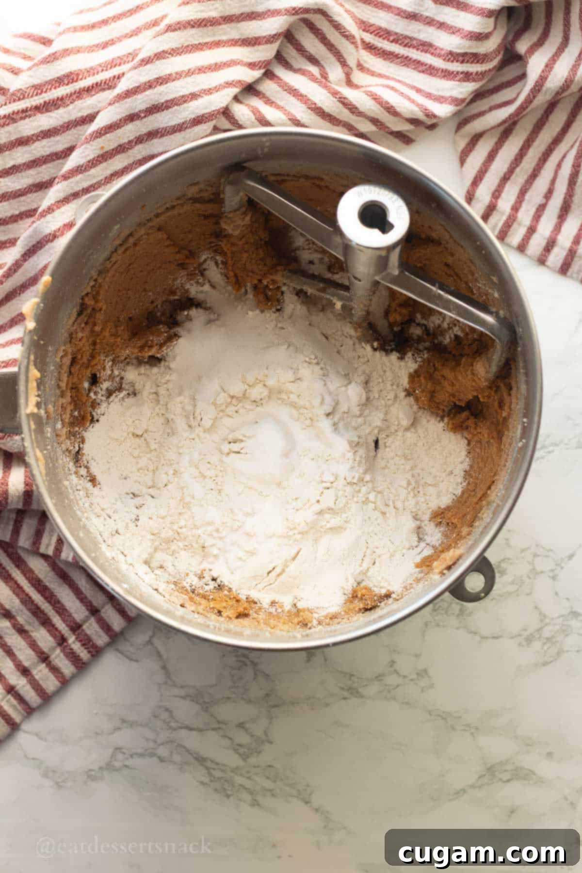 Frosted Gingerbread Squares 7 Flour being added to the gingerbread batter.