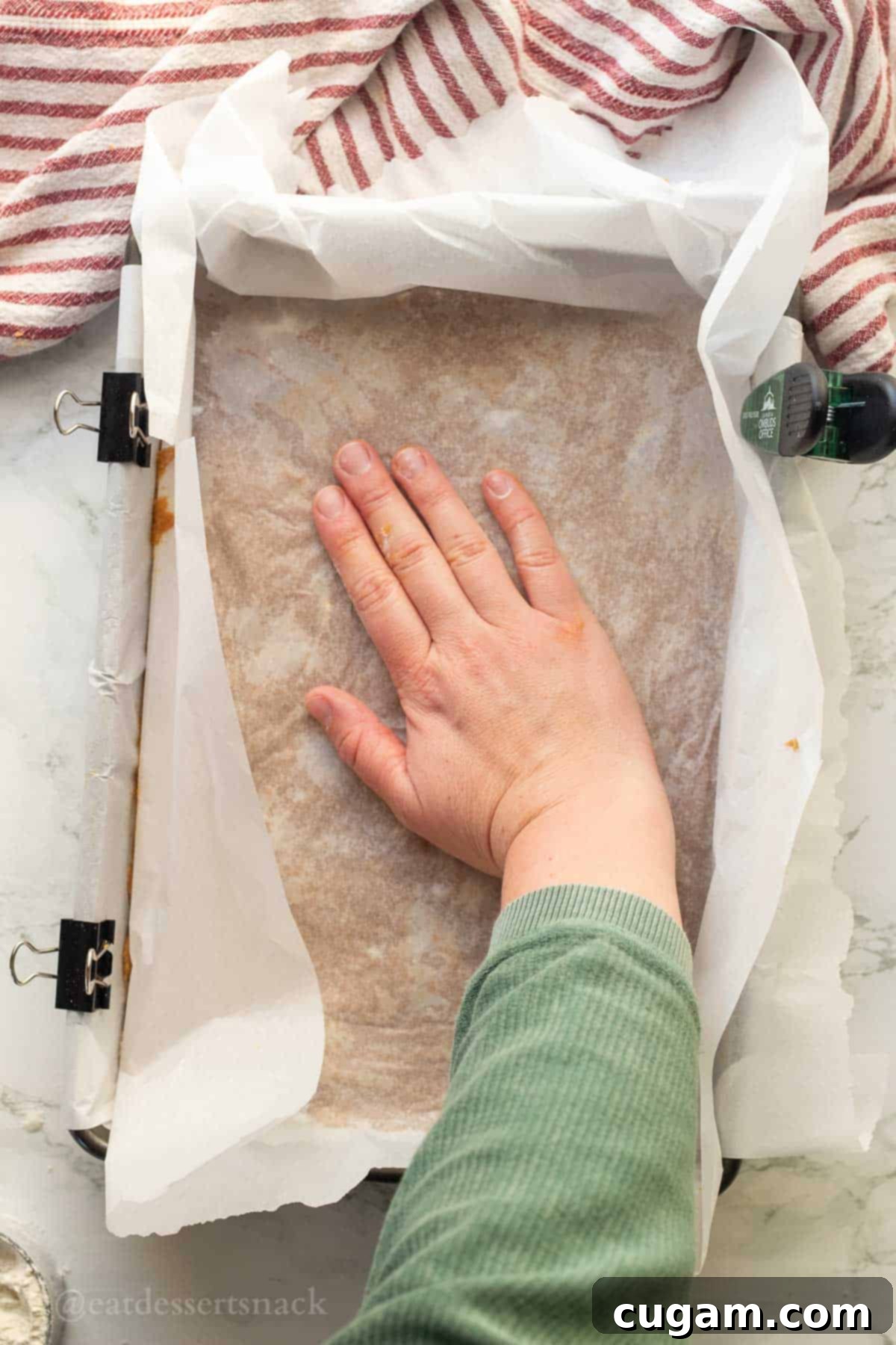 Frosted Gingerbread Squares 8 Spreading the gingerbread dough evenly in a baking pan.