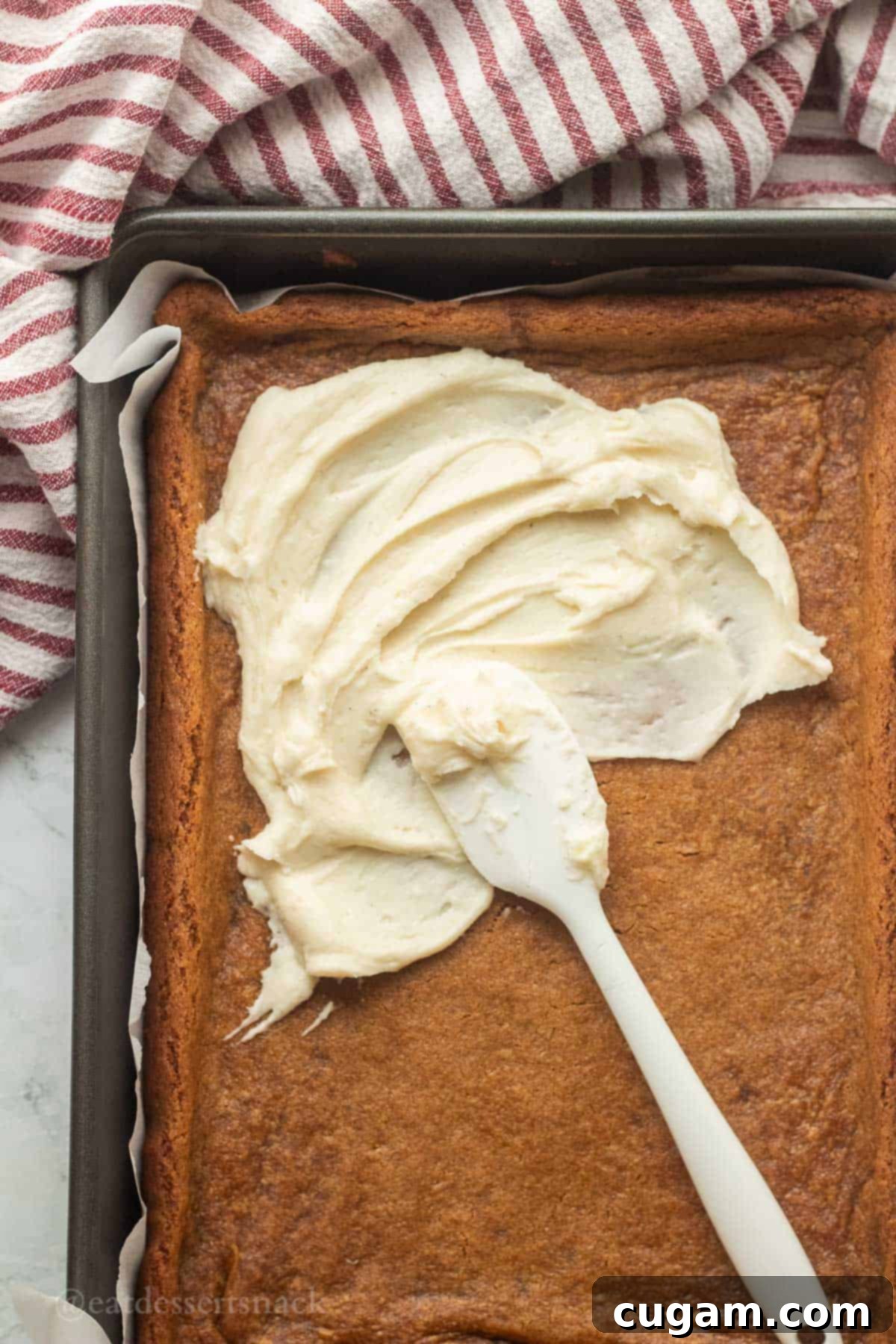 Frosted Gingerbread Squares 10 Spreading frosting over the cooled gingerbread bars.
