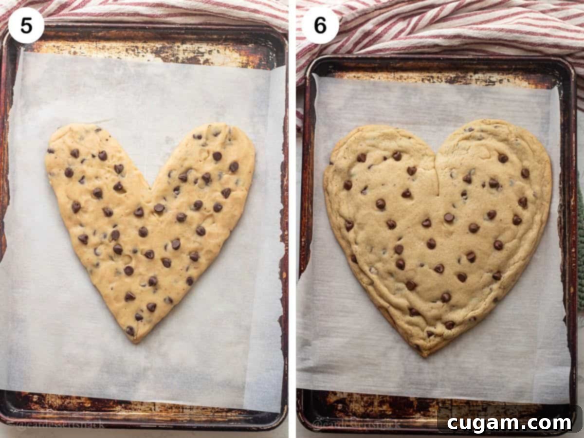 Frosted Heart Cookie Slab 6 Cookie dough being shaped into a heart on parchment paper, ready for baking, showing the hand-shaped method.