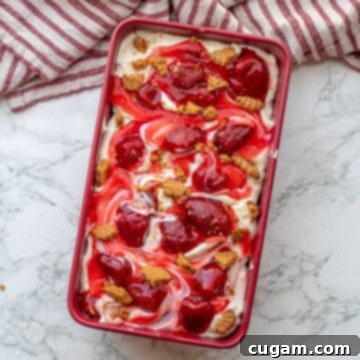 Strawberry cheesecake ice cream in a pan.