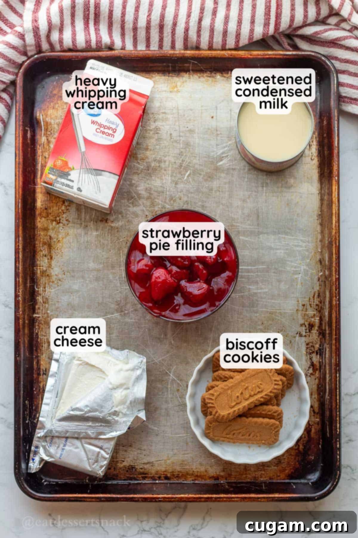 Strawberry Cheesecake Ice Cream (Easy Homemade Recipe) 3 Labeled ingredients for strawberry cheesecake ice cream in metal pan.