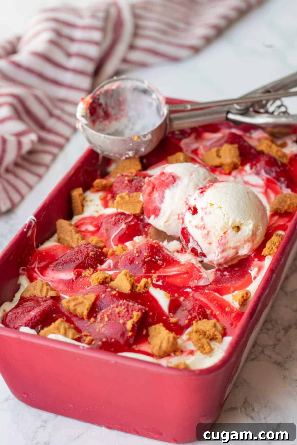 Strawberry Cheesecake Ice Cream (Easy Homemade Recipe) 9 Scoops of cheesecake ice cream in a pan.