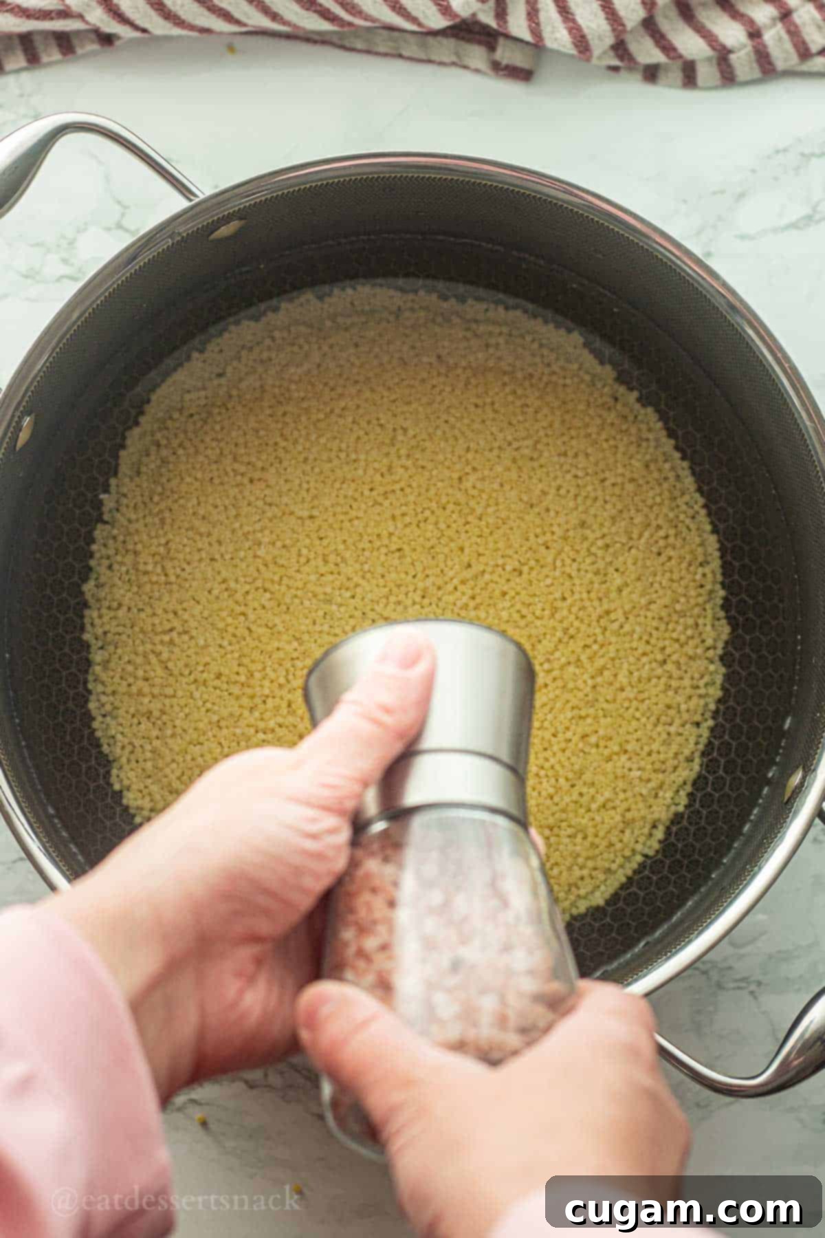 Frog Eye Salad 4 Salt shaker above pot of uncooked acini de pepe noodles.