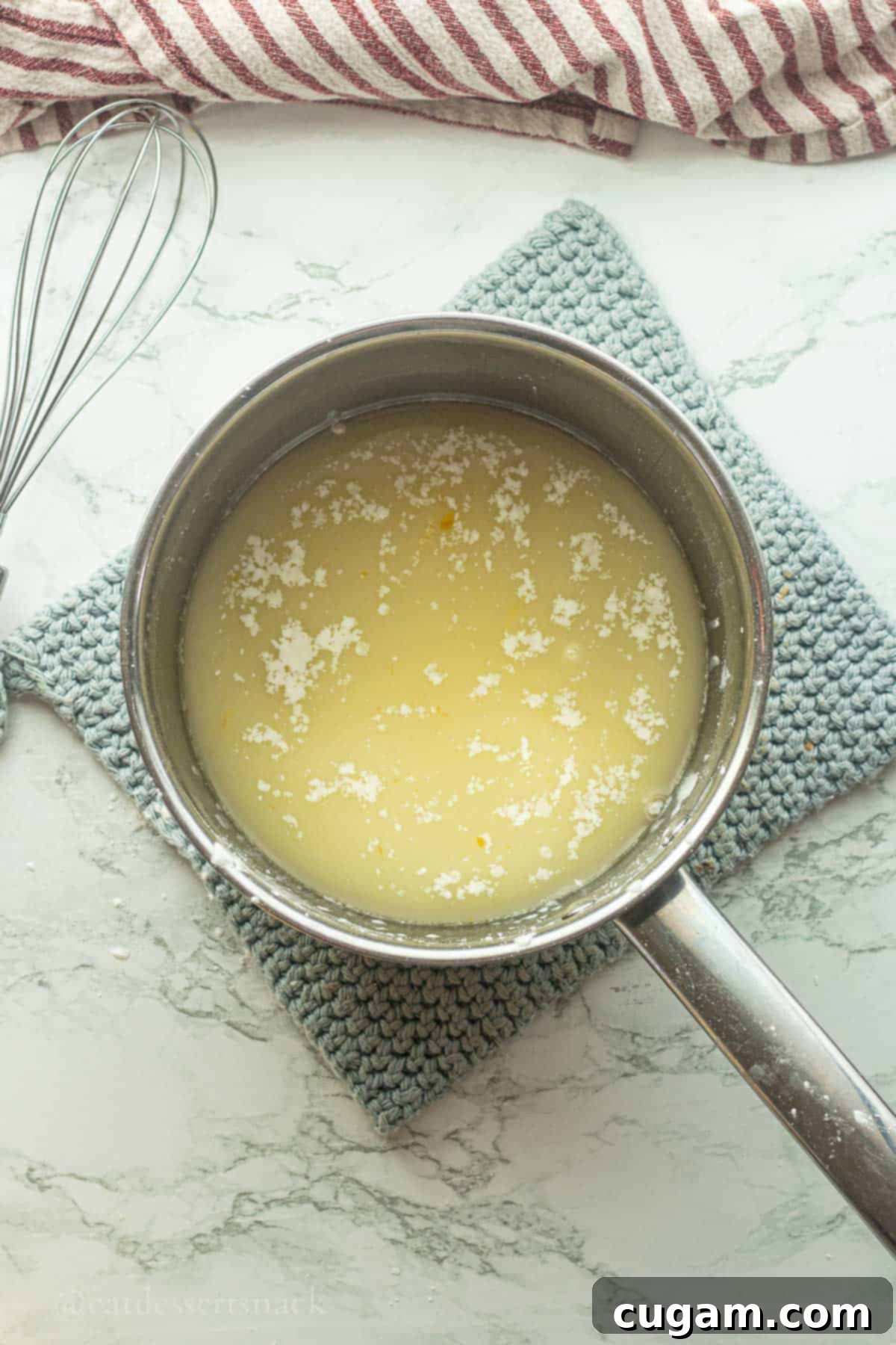 Frog Eye Salad 5 Pineapple and orange juice and cornstarch in pot.