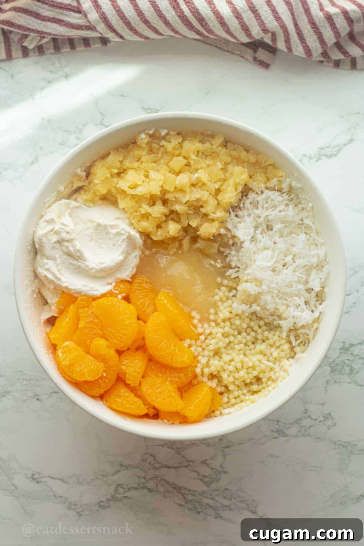 Frog Eye Salad 8 Ingredients for frog eye salad in bowl layered.