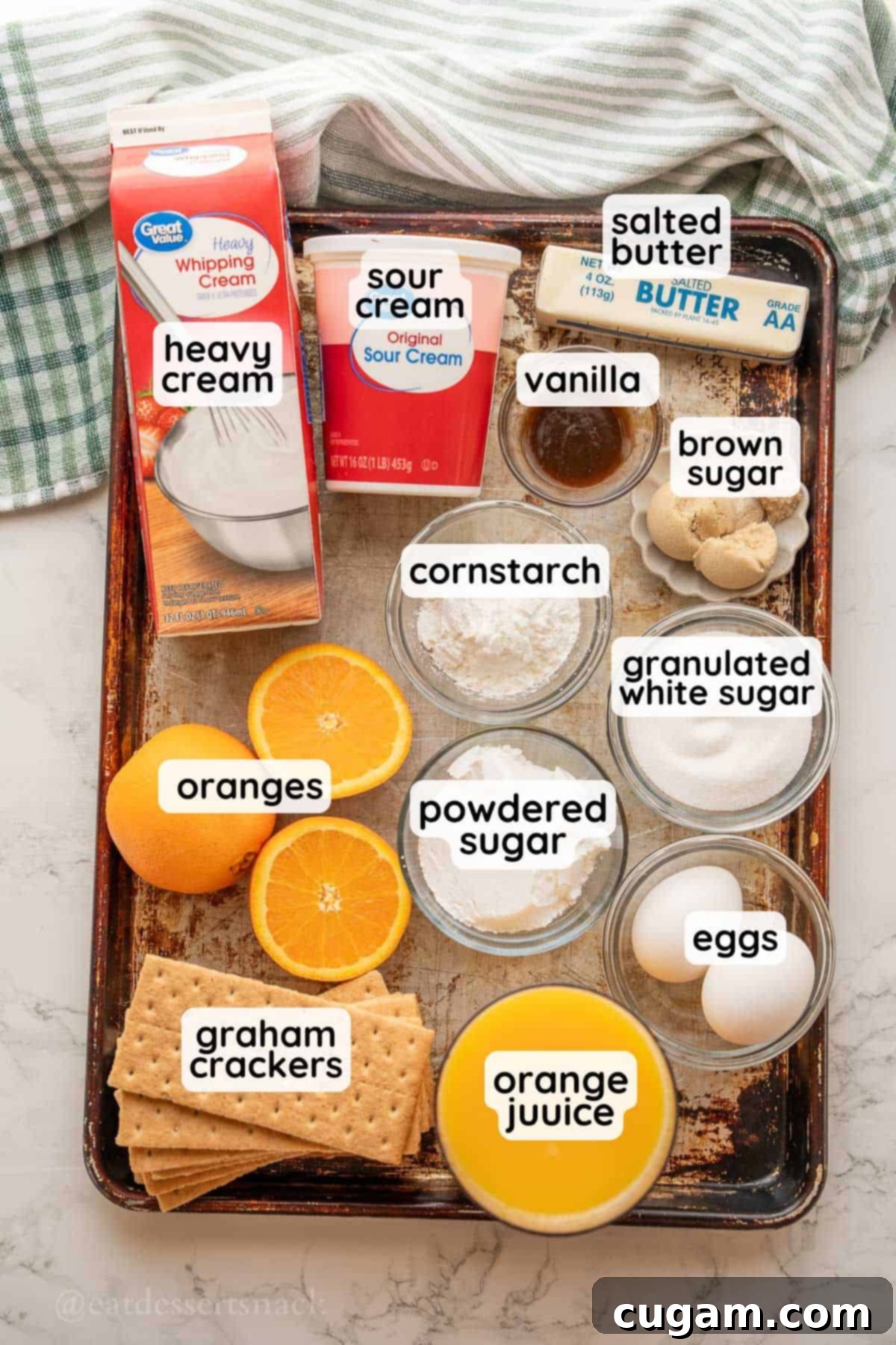 Sunshine Citrus Dream Pie 3 Labeled ingredients for orange pie in glass dishes on metal pan.